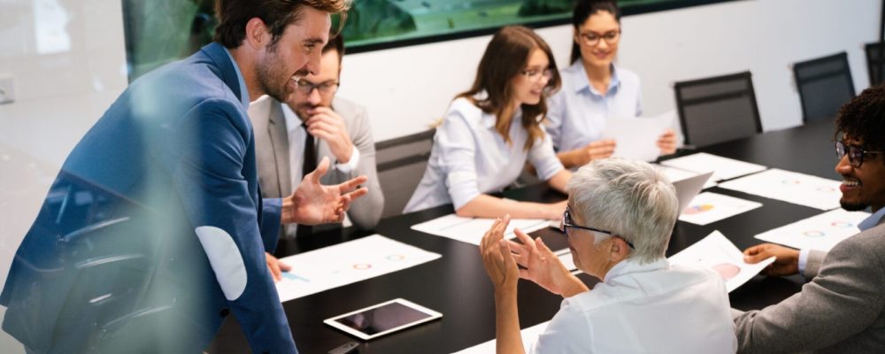 Creative group of business people working on business project in office